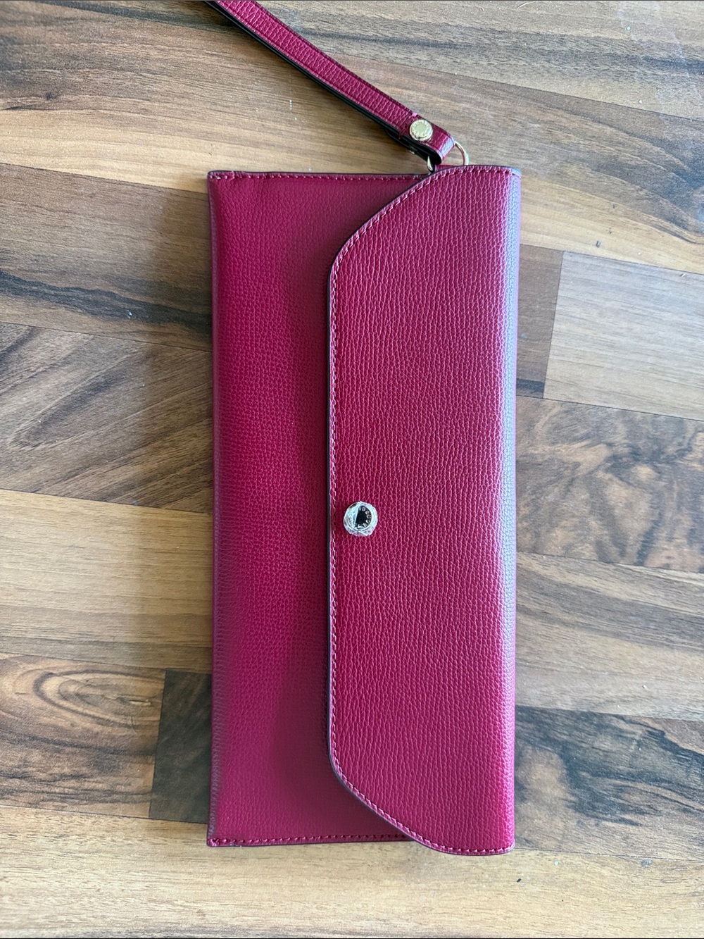 Henri Bendel Pebbled Leather Wristlet in red wine color